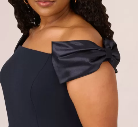 Adrianna Papell Plus Size Off The Shoulder Crepe Column Gown With Bow Accents In TWILIGHT New